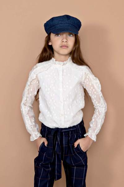 TikkyB blouse with ruffles on sleeve and shoulder in embroidery anglaise